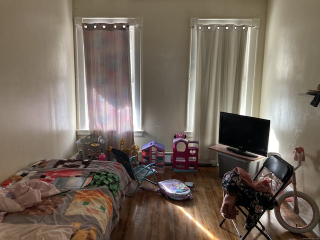 bedroom with wood finished floors