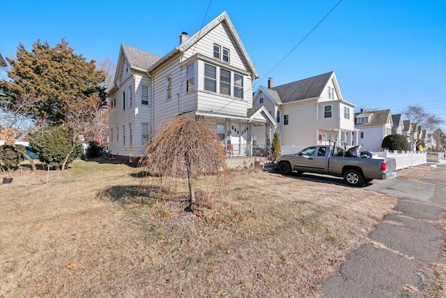 view of property with a front lawn