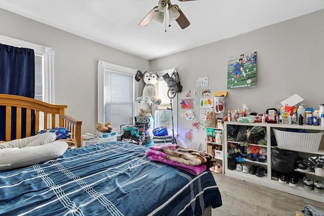 bedroom featuring ceiling fan and hardwood / wood-style floors