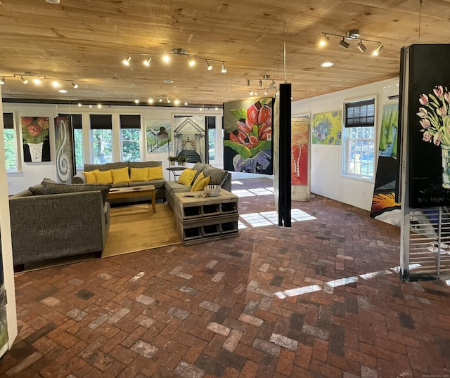 44 Brook St, Groton, CT 06340 - living area featuring a healthy amount of sunlight, wooden ceiling, and brick floor