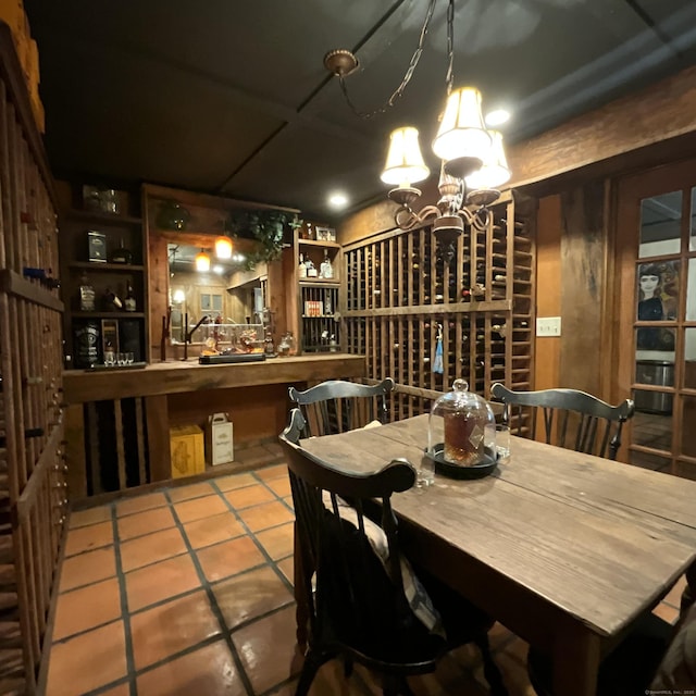 44 Brook St, Groton, CT 06340 - wine cellar with tile patterned flooring, lofted ceiling, and a chandelier