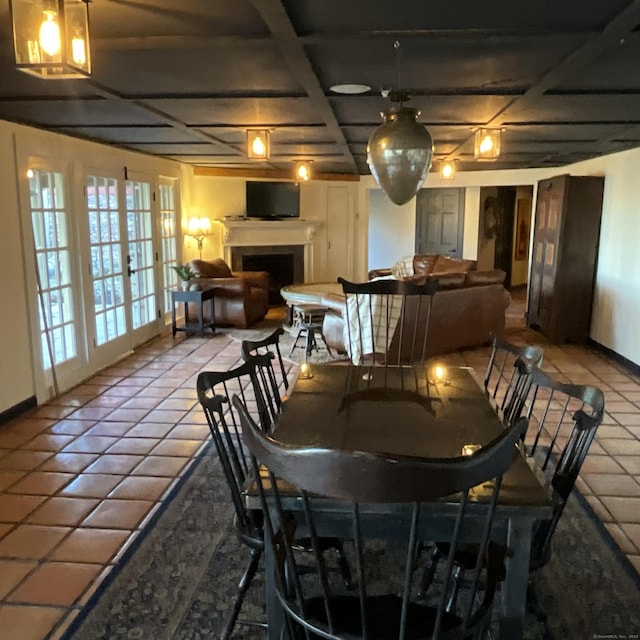 44 Brook St, Groton, CT 06340 - tiled dining room with baseboards and a fireplace