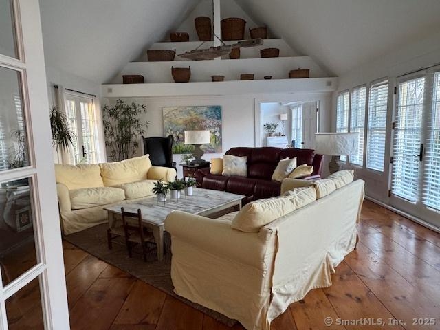 44 Brook St, Groton, CT 06340 - living room featuring a healthy amount of sunlight, high vaulted ceiling, and hardwood / wood-style floors
