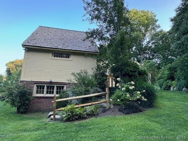 44 Brook St, Groton, CT 06340 - view of side of property featuring a yard and brick siding