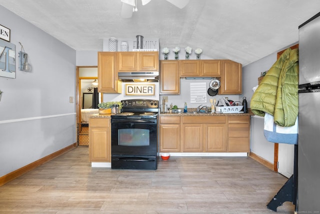 kitchen with lofted ceiling, sink, light stone counters, black electric range, and light hardwood / wood-style floors