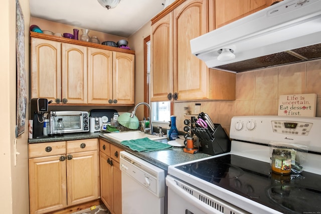 kitchen with sink, light brown cabinets, and white appliances