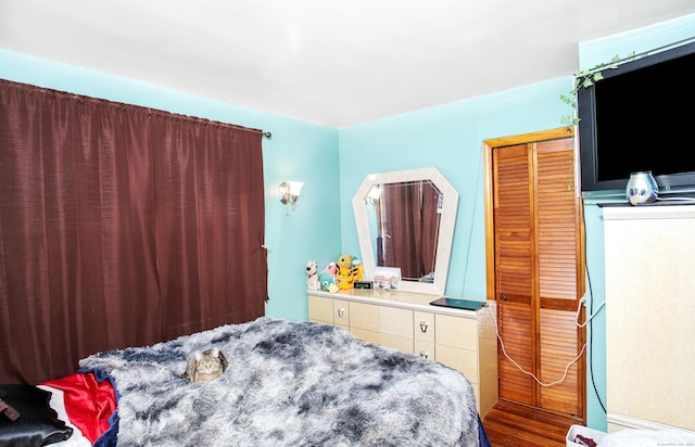 bedroom with hardwood / wood-style flooring