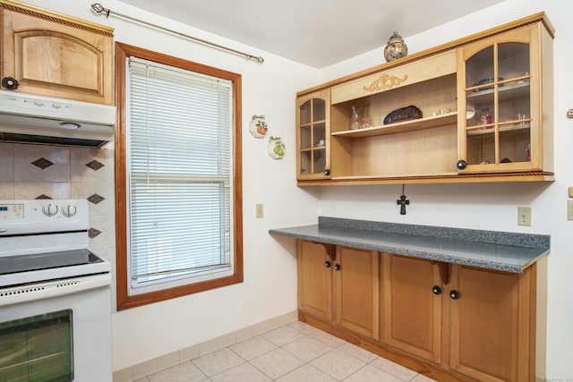 kitchen featuring white range with electric cooktop and light tile patterned floors