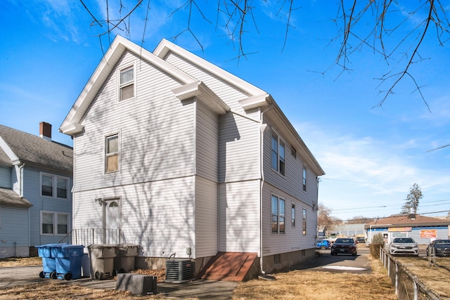 view of side of property featuring central AC