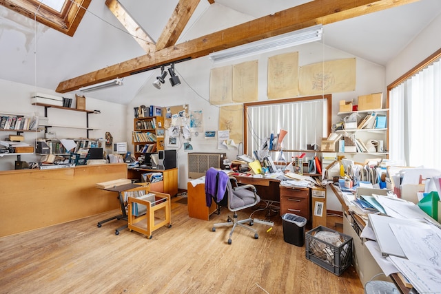 office area featuring beamed ceiling, high vaulted ceiling, and light hardwood / wood-style floors