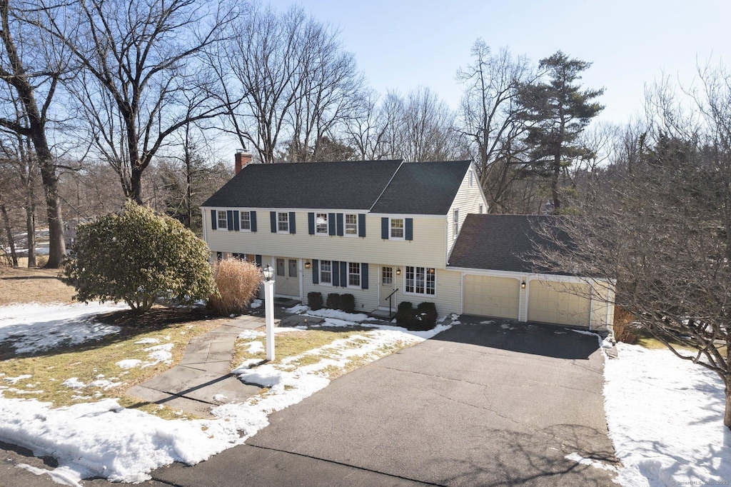 colonial home with a garage