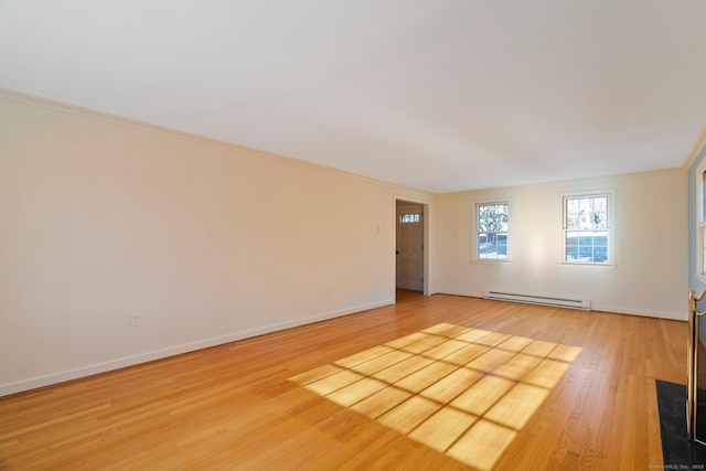 unfurnished room featuring wood-type flooring and baseboard heating