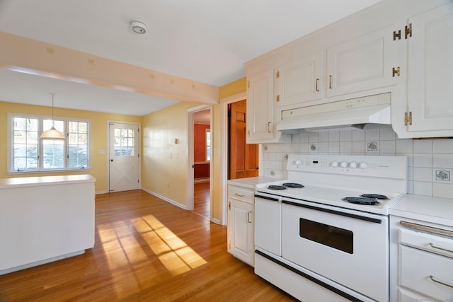 kitchen featuring pendant lighting, white cabinetry, backsplash, range with two ovens, and light hardwood / wood-style floors