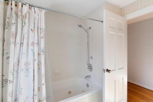 bathroom featuring wood-type flooring and shower / bath combination with curtain