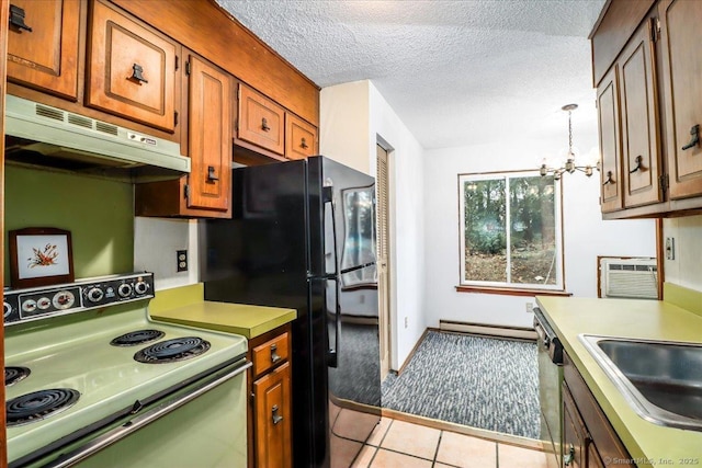 kitchen featuring light tile patterned floors, a baseboard heating unit, electric range, a textured ceiling, and black fridge