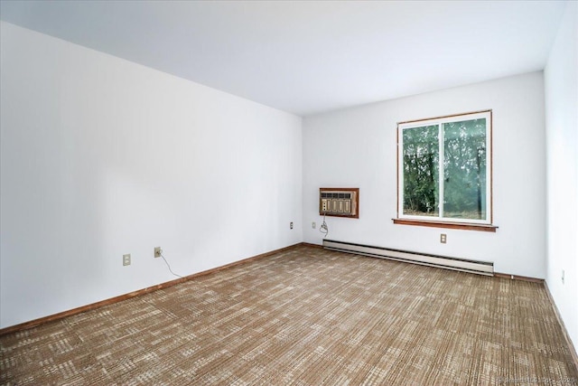 spare room with a baseboard radiator and a wall unit AC