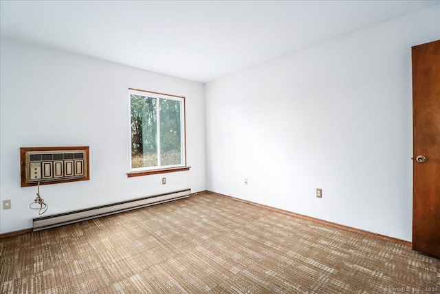 unfurnished room featuring a baseboard heating unit and an AC wall unit