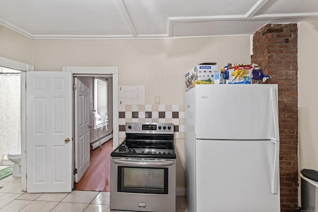 kitchen with stainless steel range with electric stovetop, light tile patterned floors, a baseboard radiator, white fridge, and backsplash