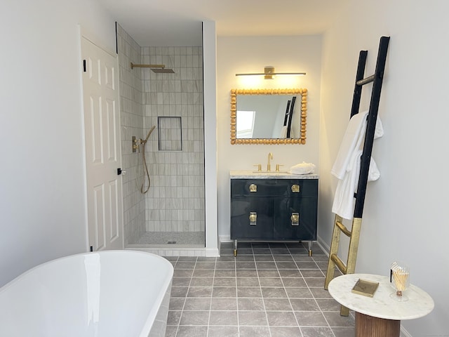 bathroom featuring vanity, independent shower and bath, and tile patterned flooring