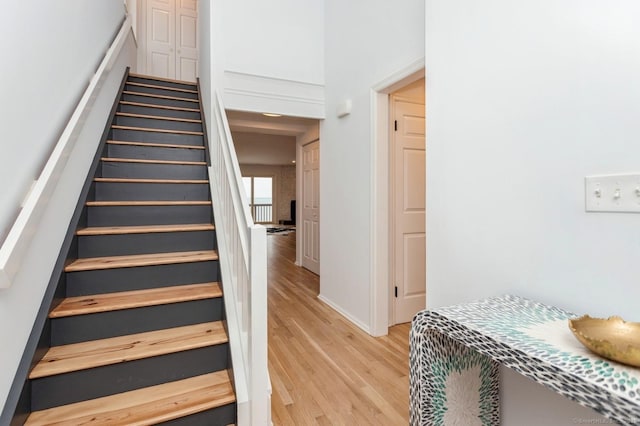 staircase with wood-type flooring