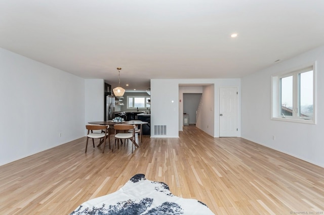 dining area with light wood-type flooring