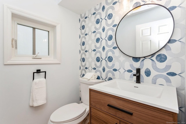 bathroom with vanity and toilet