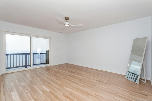 spare room with light hardwood / wood-style floors and ceiling fan