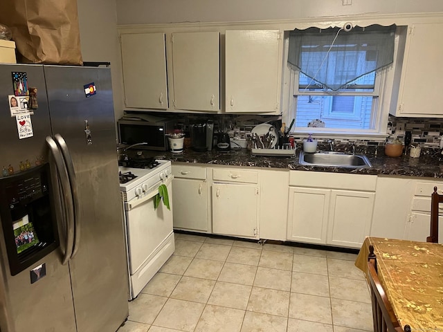 kitchen with sink, white cabinetry, stainless steel fridge with ice dispenser, white gas range, and decorative backsplash