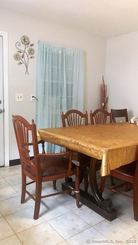 dining room with light tile patterned floors