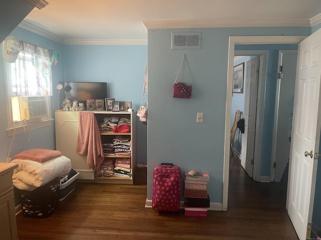 bedroom featuring crown molding, dark wood-type flooring, and cooling unit