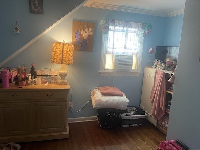 bedroom featuring ornamental molding, dark hardwood / wood-style floors, and cooling unit