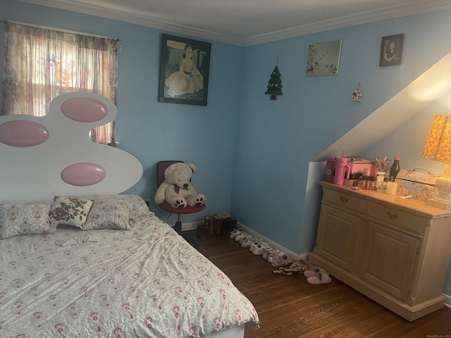 bedroom with crown molding and dark hardwood / wood-style floors