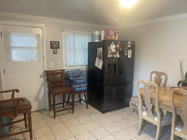 kitchen featuring crown molding, black fridge with ice dispenser, and light tile patterned floors