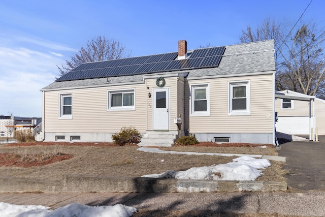 view of front of home with solar panels