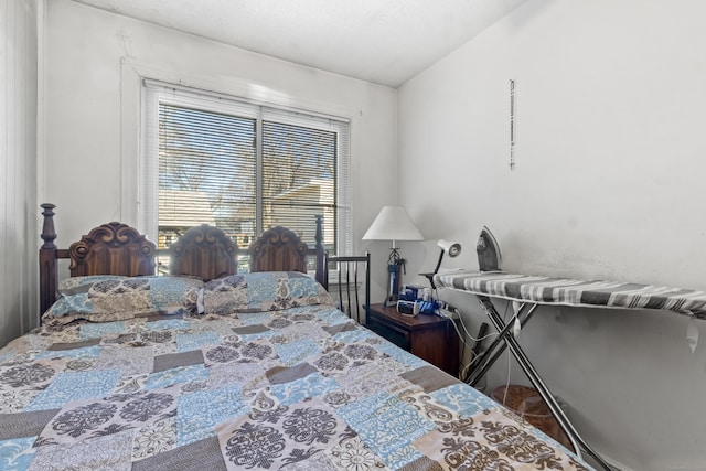 bedroom featuring vaulted ceiling