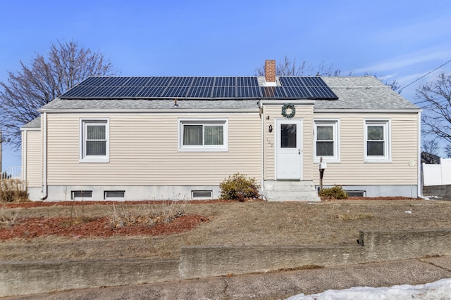 view of front of house with solar panels