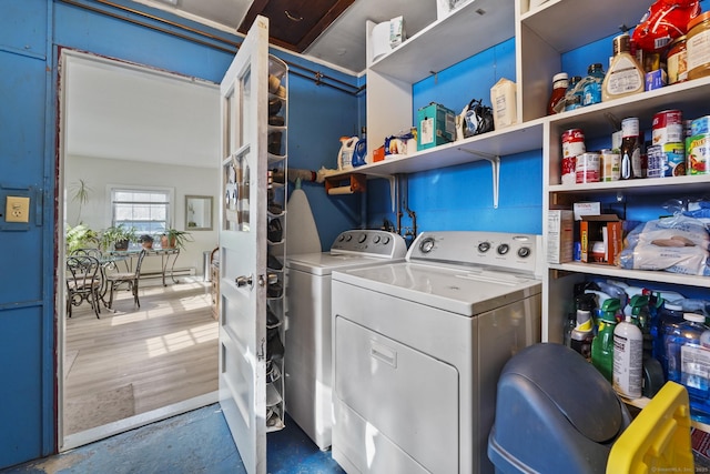 laundry area featuring wood-type flooring and washer and dryer