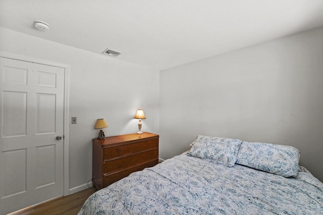 bedroom featuring hardwood / wood-style floors