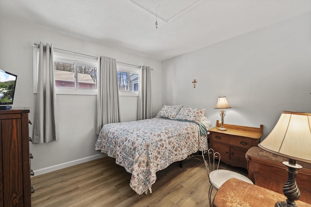 bedroom with wood-type flooring