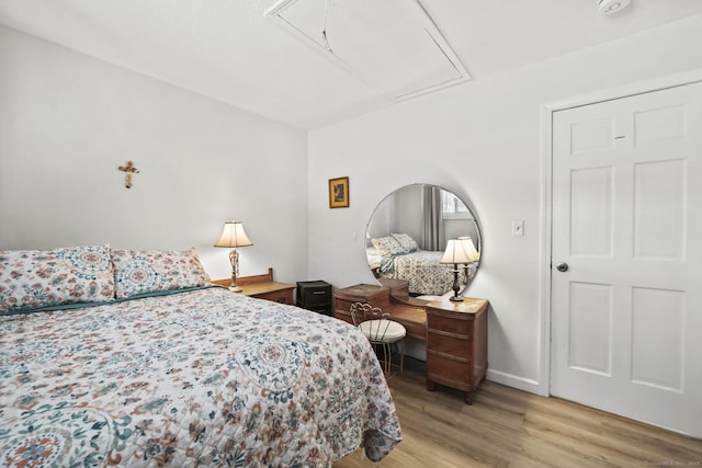 bedroom with light hardwood / wood-style floors