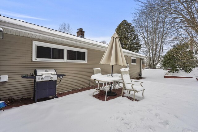 view of snow covered house