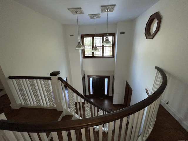 stairs featuring a high ceiling