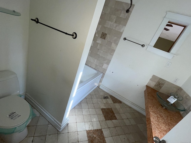 bathroom featuring bathtub / shower combination and toilet