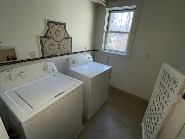 laundry room with washer and dryer and tile patterned floors