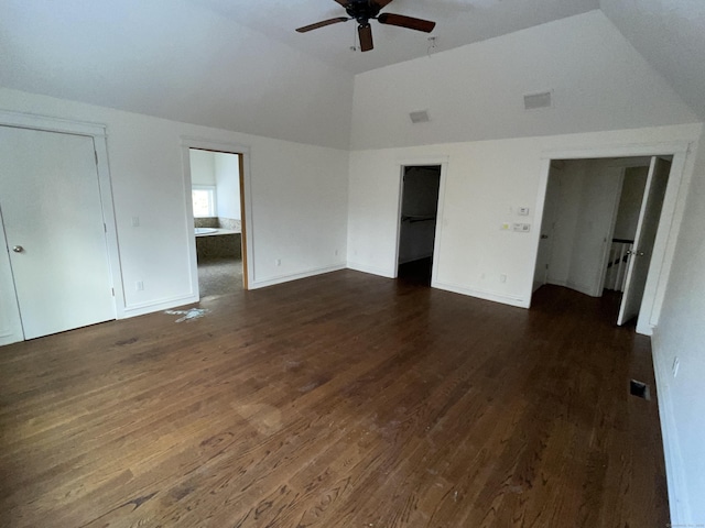 interior space featuring lofted ceiling, dark wood-type flooring, and ceiling fan