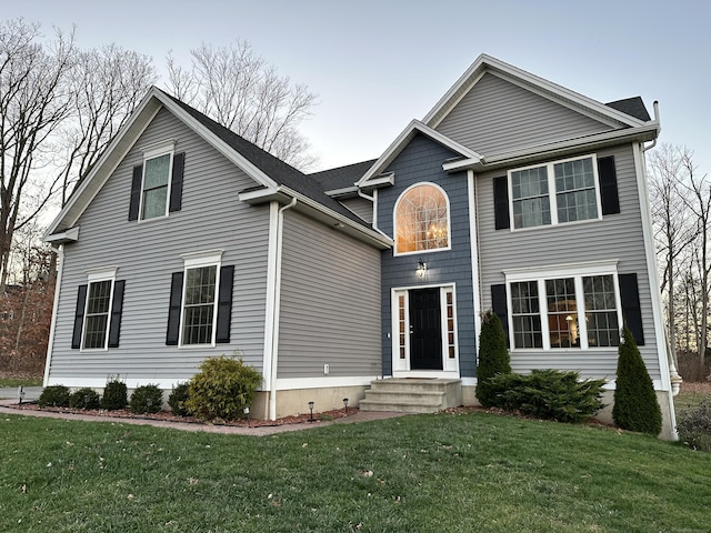 view of front property featuring a front yard