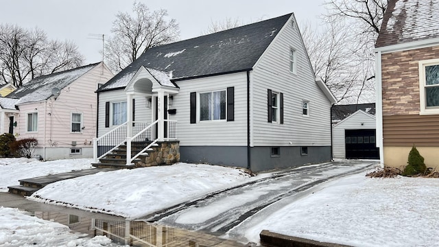 view of front of property with an outbuilding and a garage