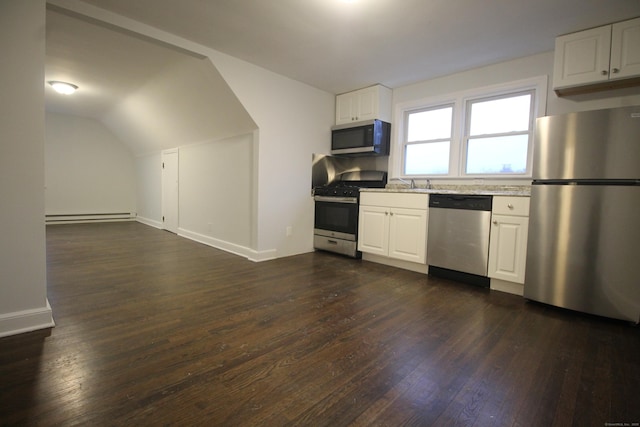 kitchen with appliances with stainless steel finishes, a baseboard radiator, lofted ceiling, white cabinets, and dark hardwood / wood-style flooring