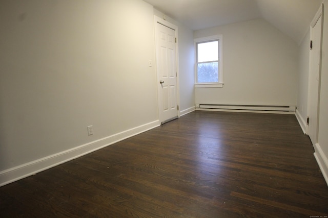 additional living space with dark hardwood / wood-style flooring, a baseboard radiator, and lofted ceiling