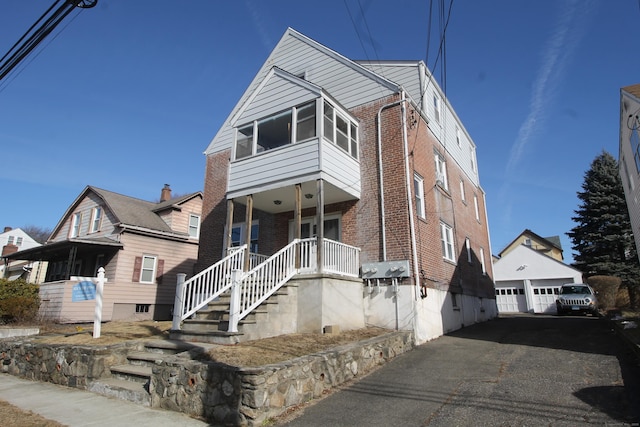 view of front of property with a garage and covered porch